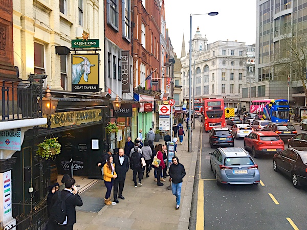 High Street Kensington bustles with people, pubs & plummy shops